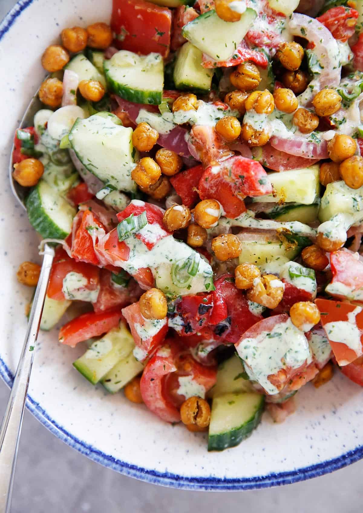 Lexi S Clean Kitchen Tomato Cucumber Salad With Crispy Chickpeas Green Yogurt Dressing