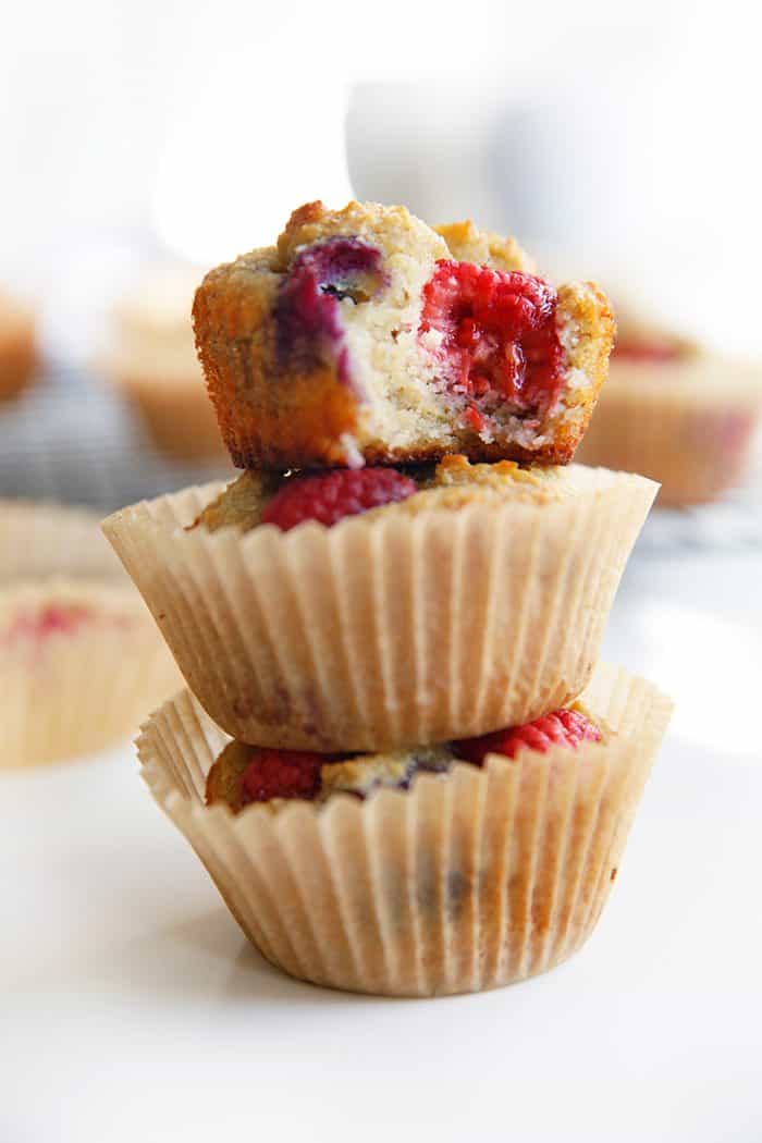 Paleo banana muffins with blueberries stacked up