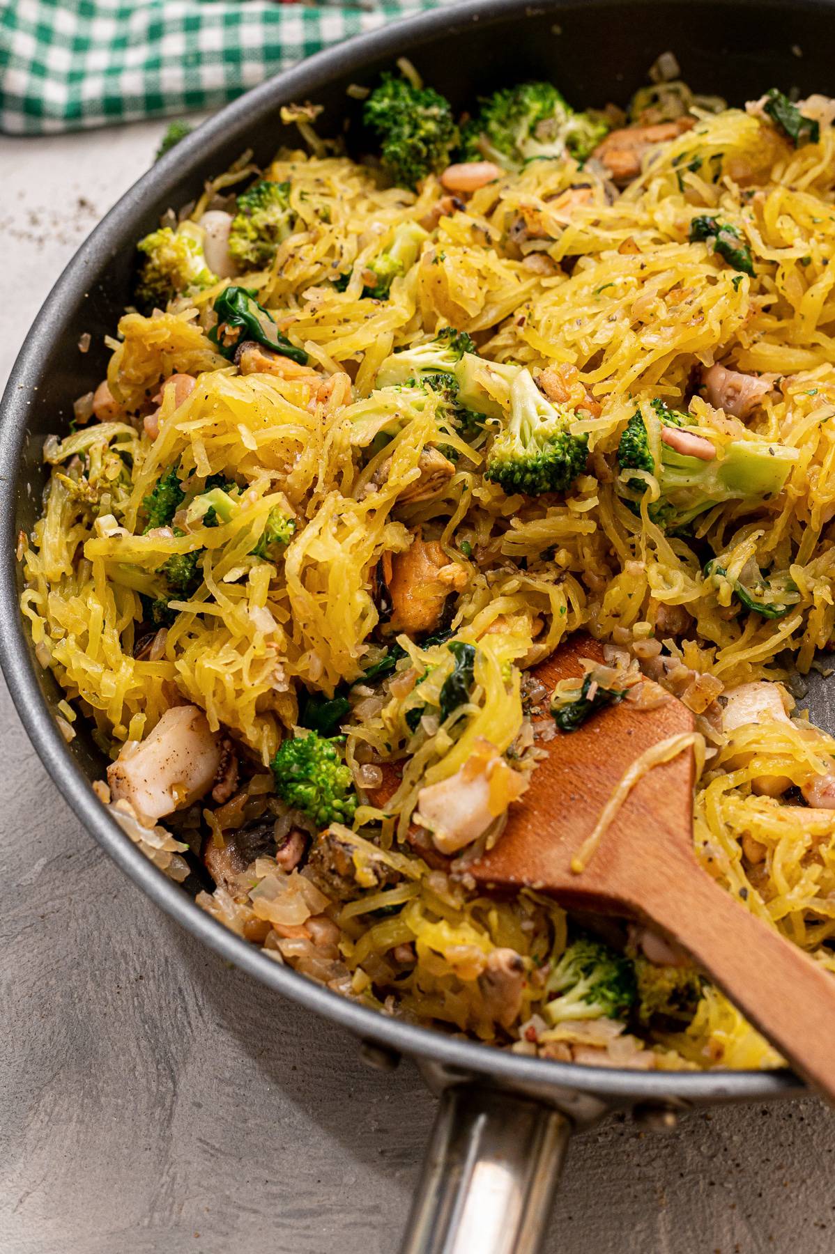 A skillet of seafood spaghetti squash.