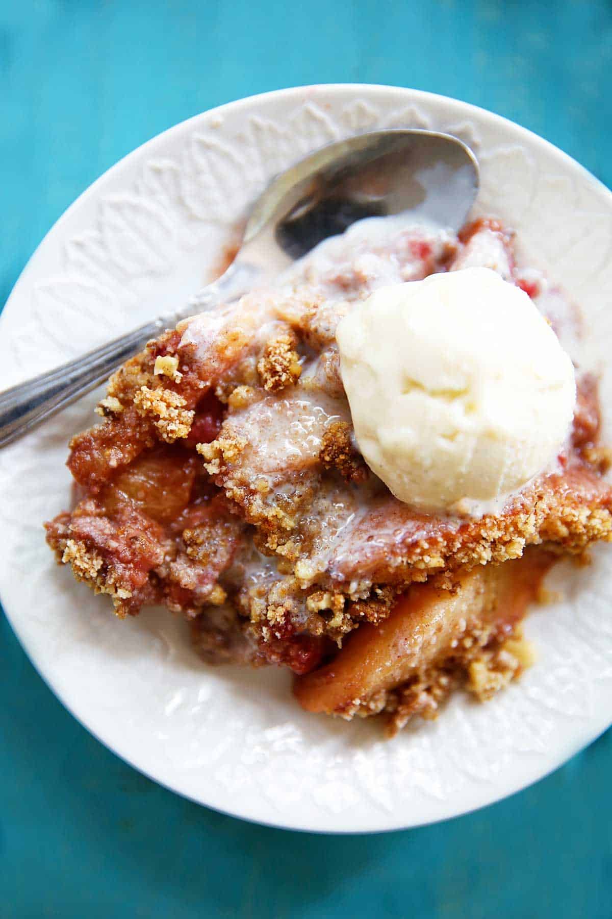 Raspberry Peach Crumble with ice cream on top.