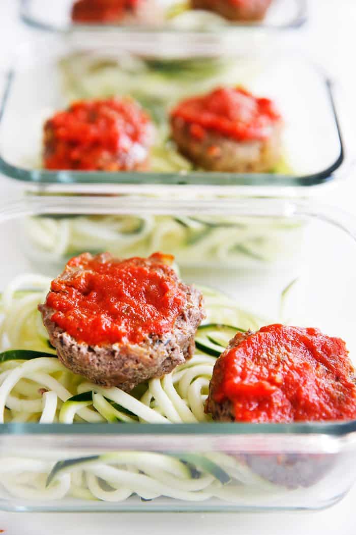 Paleo mini meatloaf muffins with tomato sauce on them