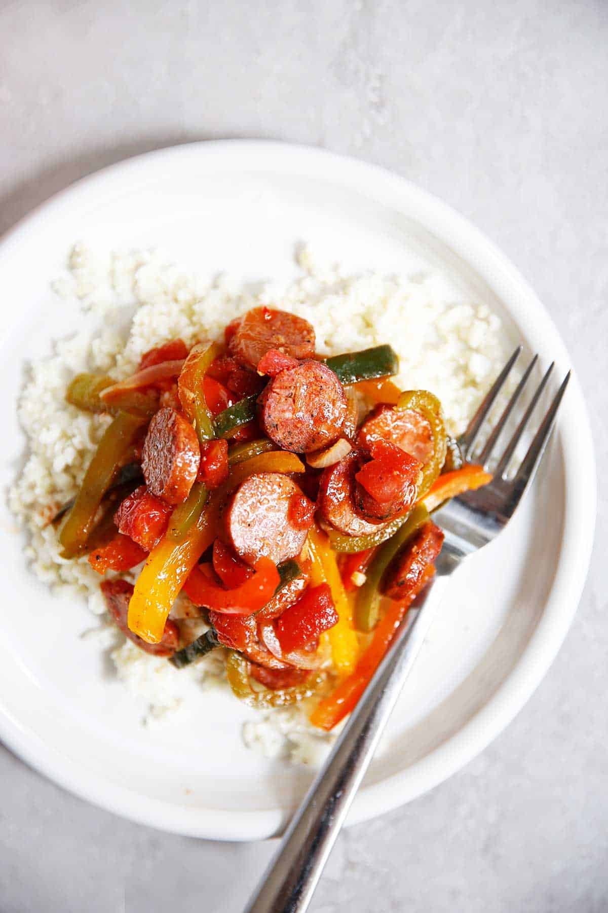 sausage peppers and onions over rice