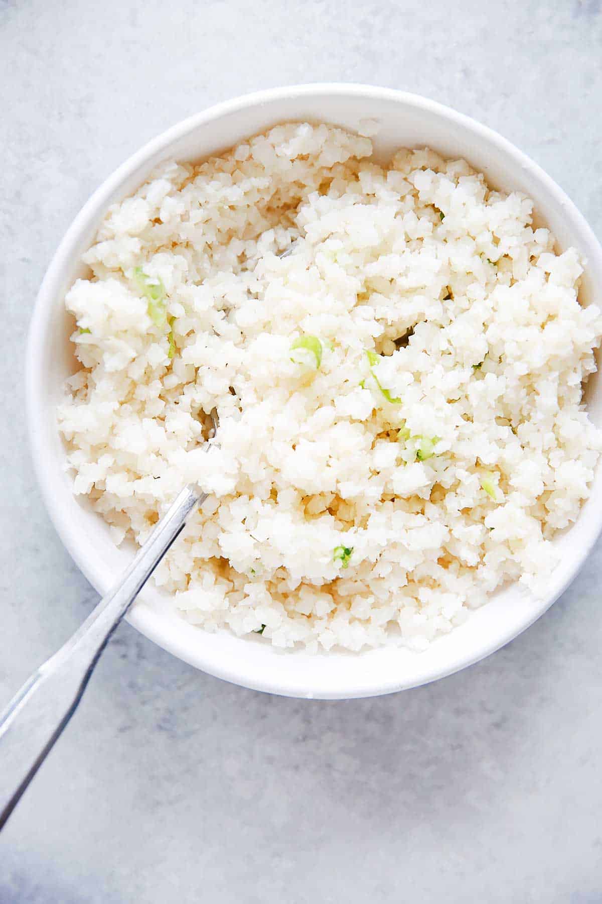 Cauliflower rice served with paleo chicken stir fry sauce