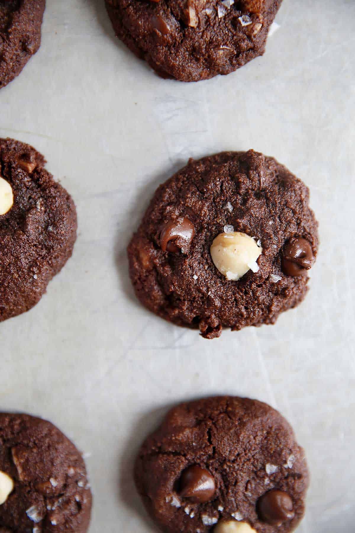 above image of gluten free chocolate cookies on parchment paper.
