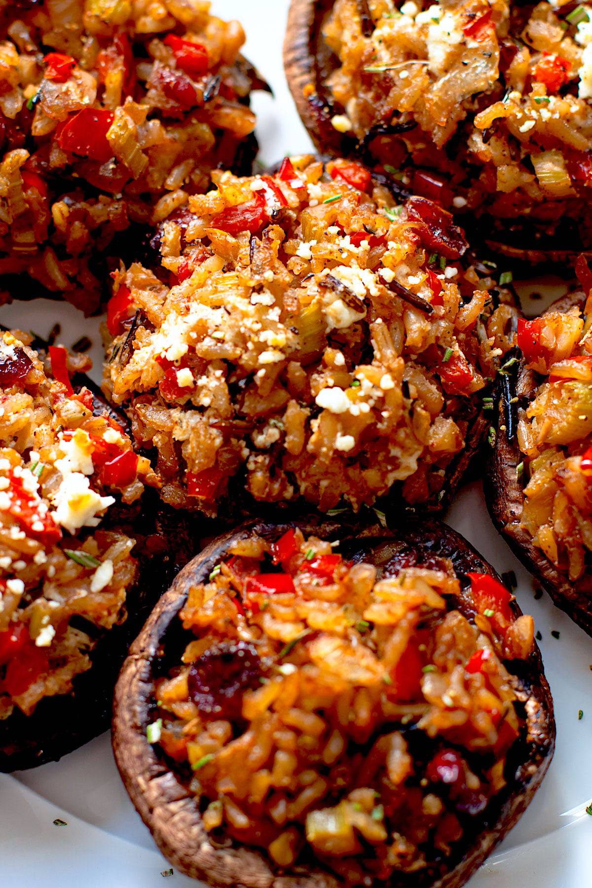 Vegetarian stuffed mushrooms on a plate.