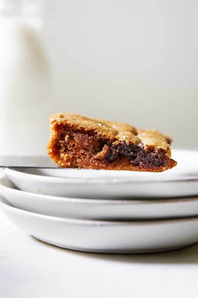 Cookie bar being placed on a plate.