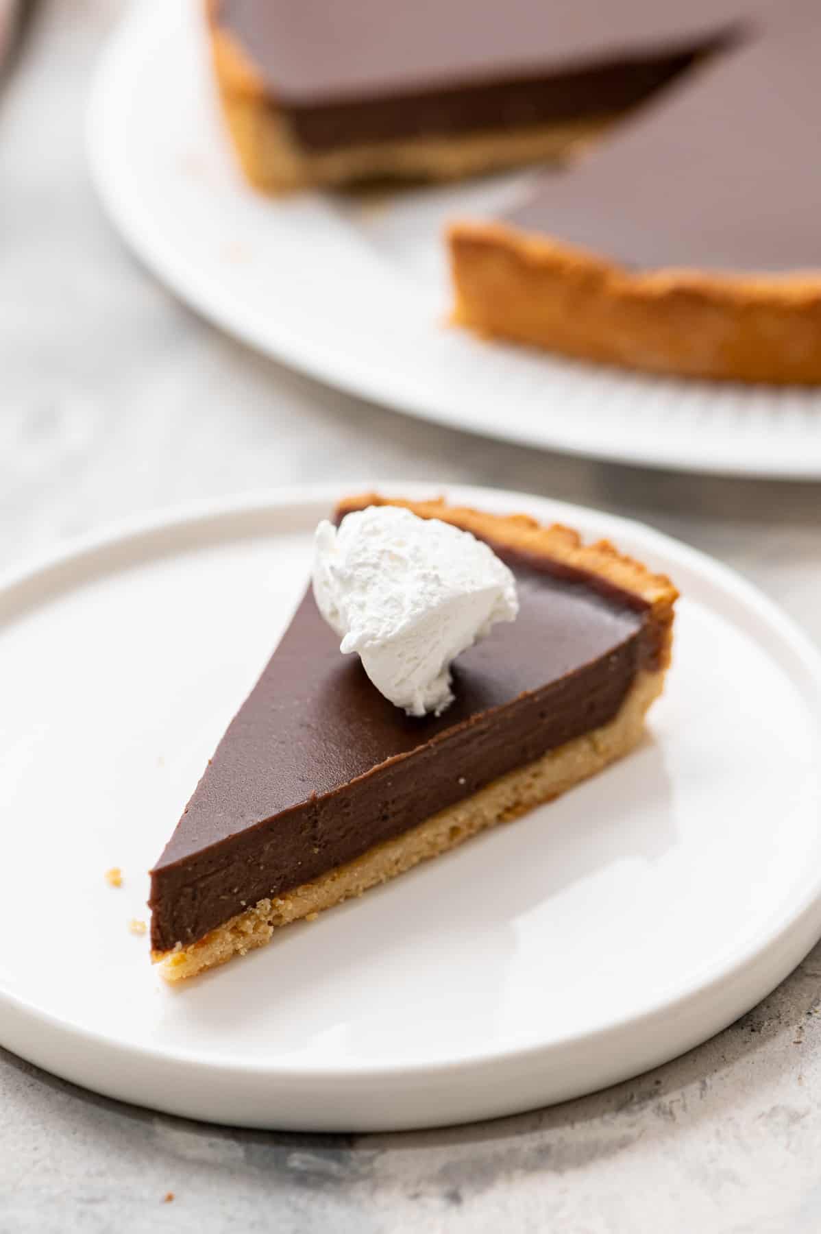 A slice of gluten-free chocolate tart.