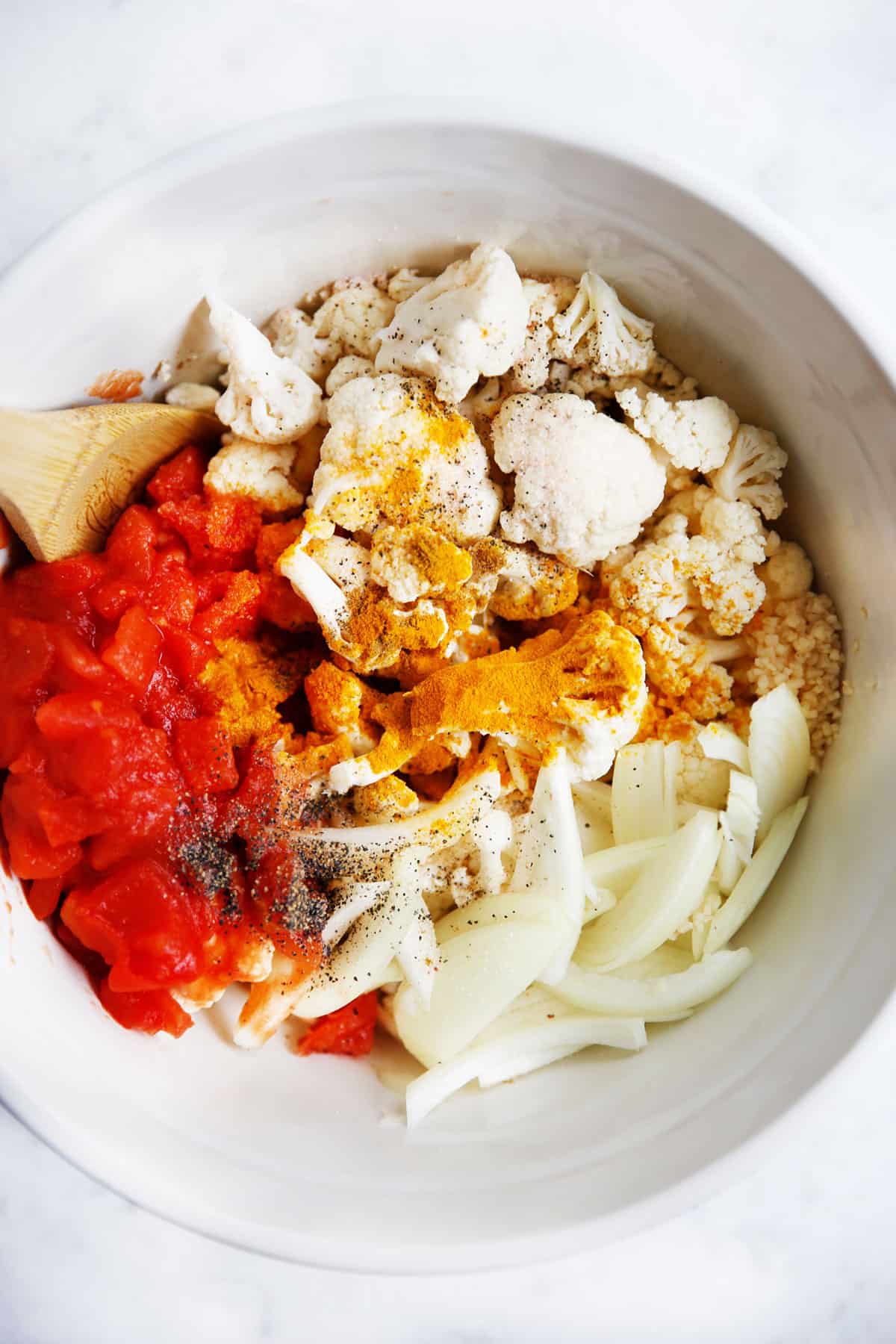 Ingredients for spiced cauliflower in a bowl.