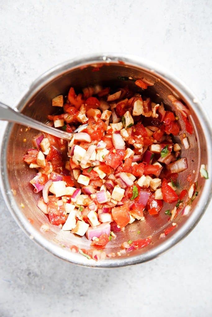 Bruschetta Chicken Recipe in a bowl before going on the chicken