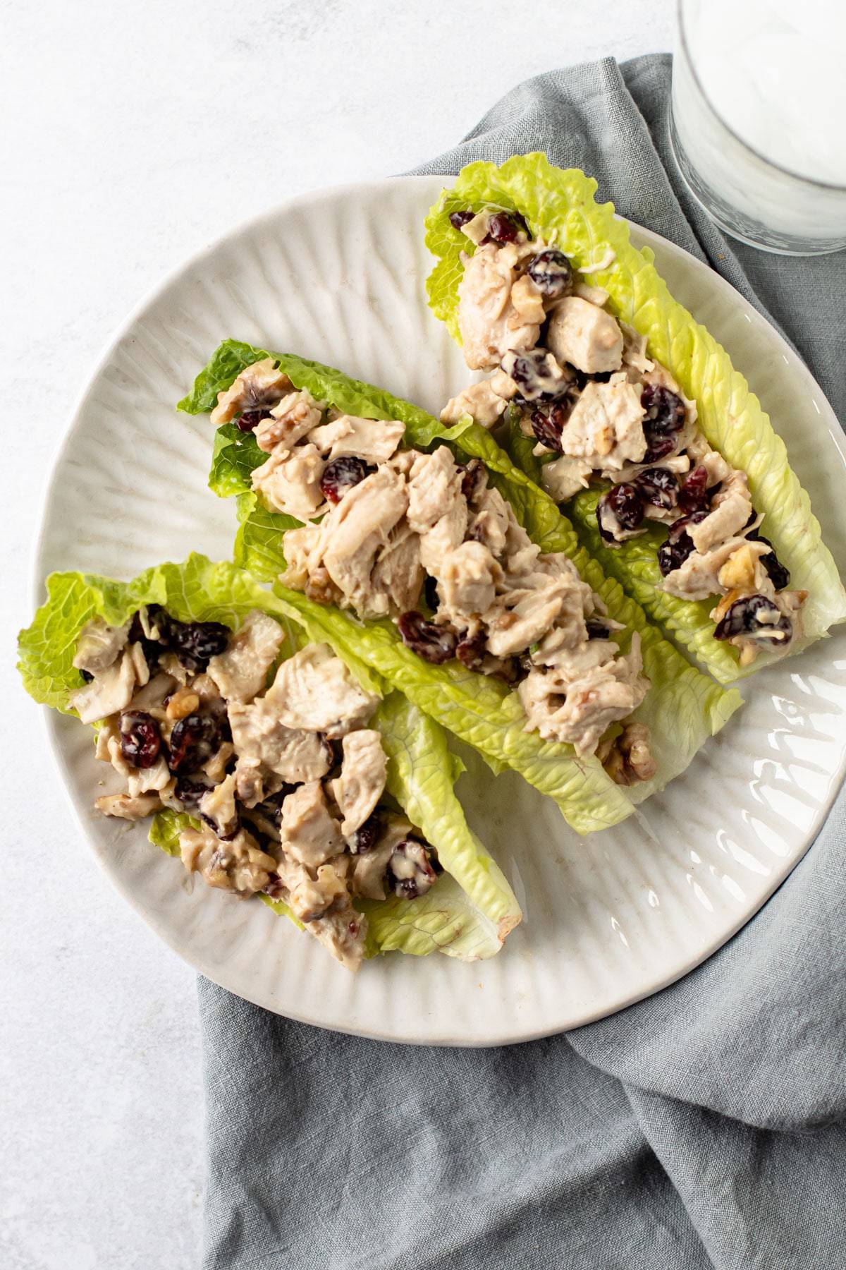 Cranberry Chicken salad served in lettuce boats.