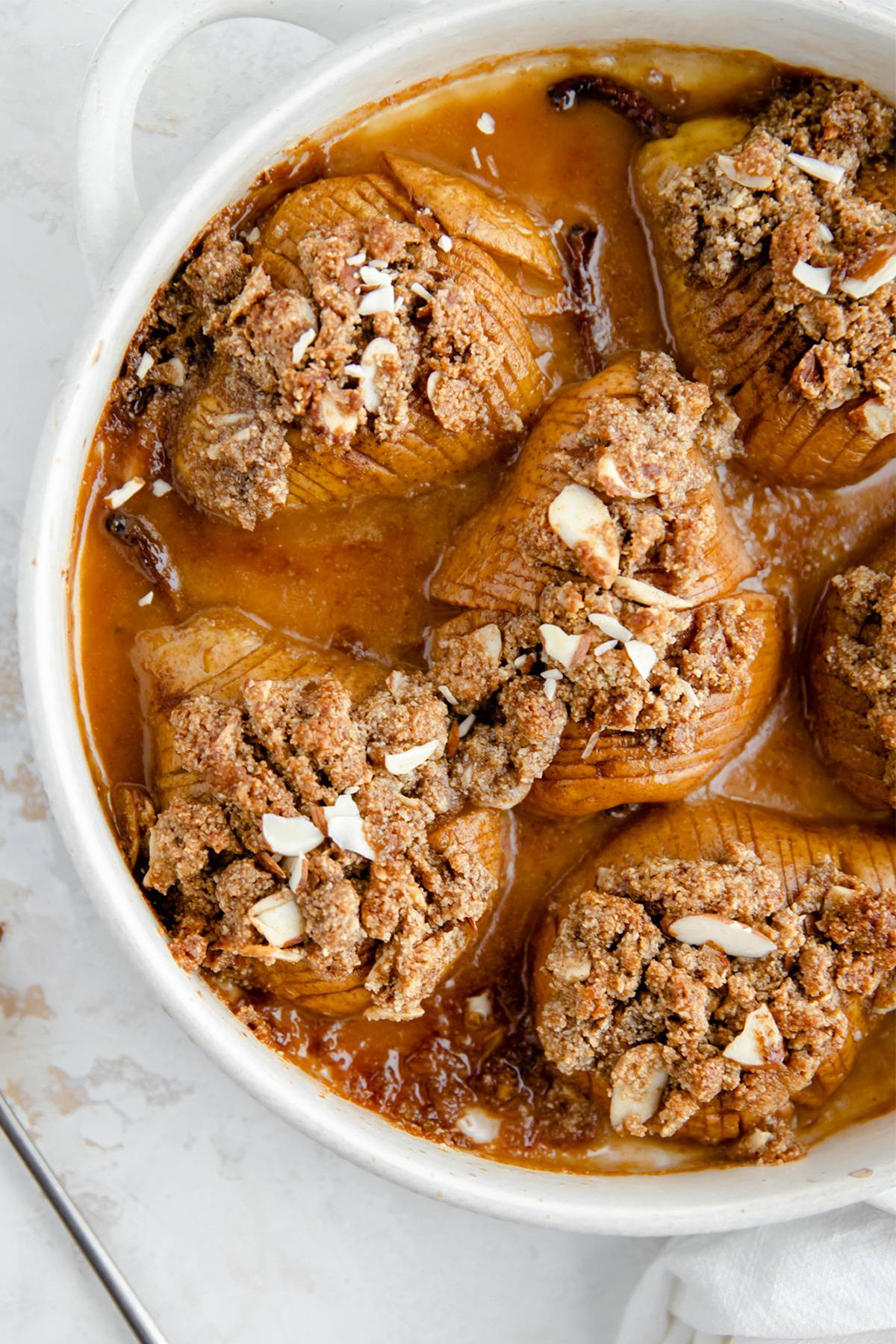 Hasselback pears in a dish.