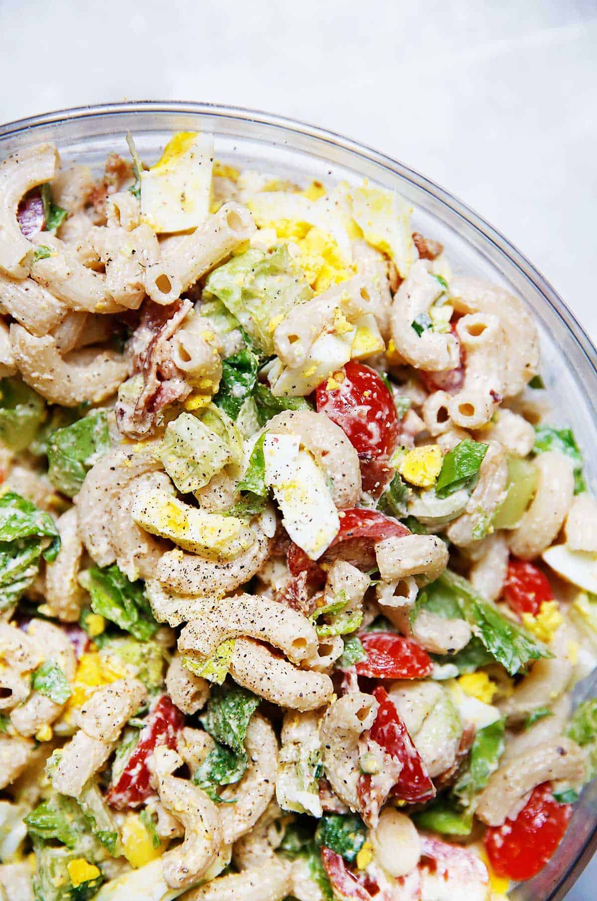 closeup of a serving bowl of pasta salad.