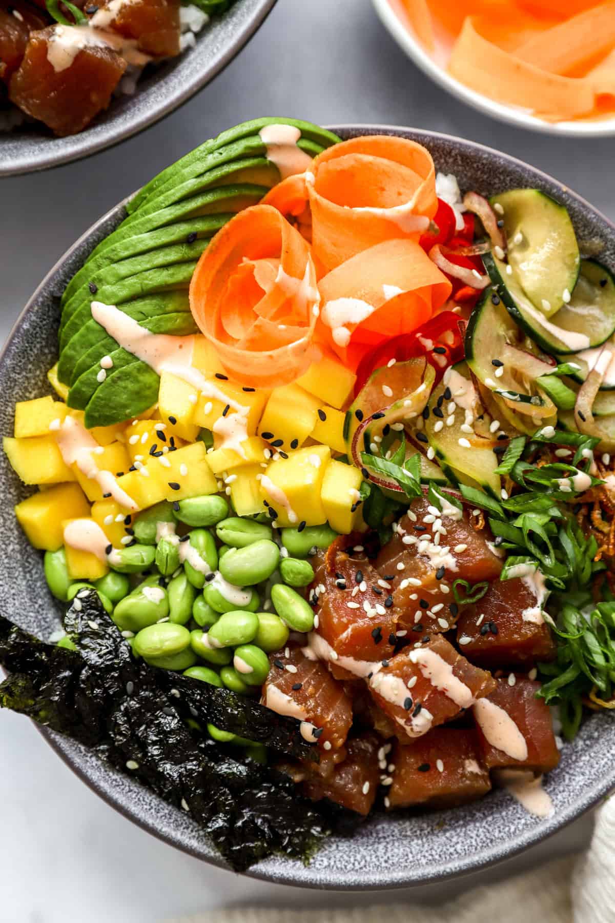 The photo above is a close-up of a poke sushi bowl.