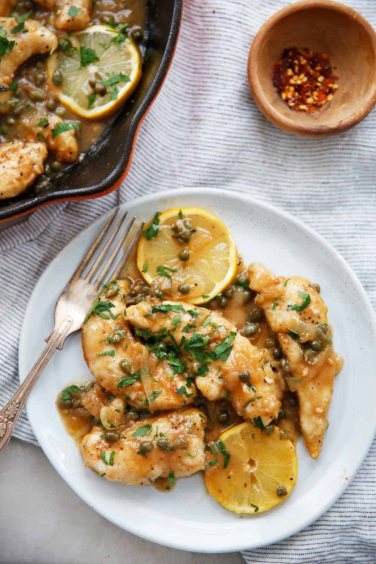 Gluten free chicken piccata with lemon and capers on a plate