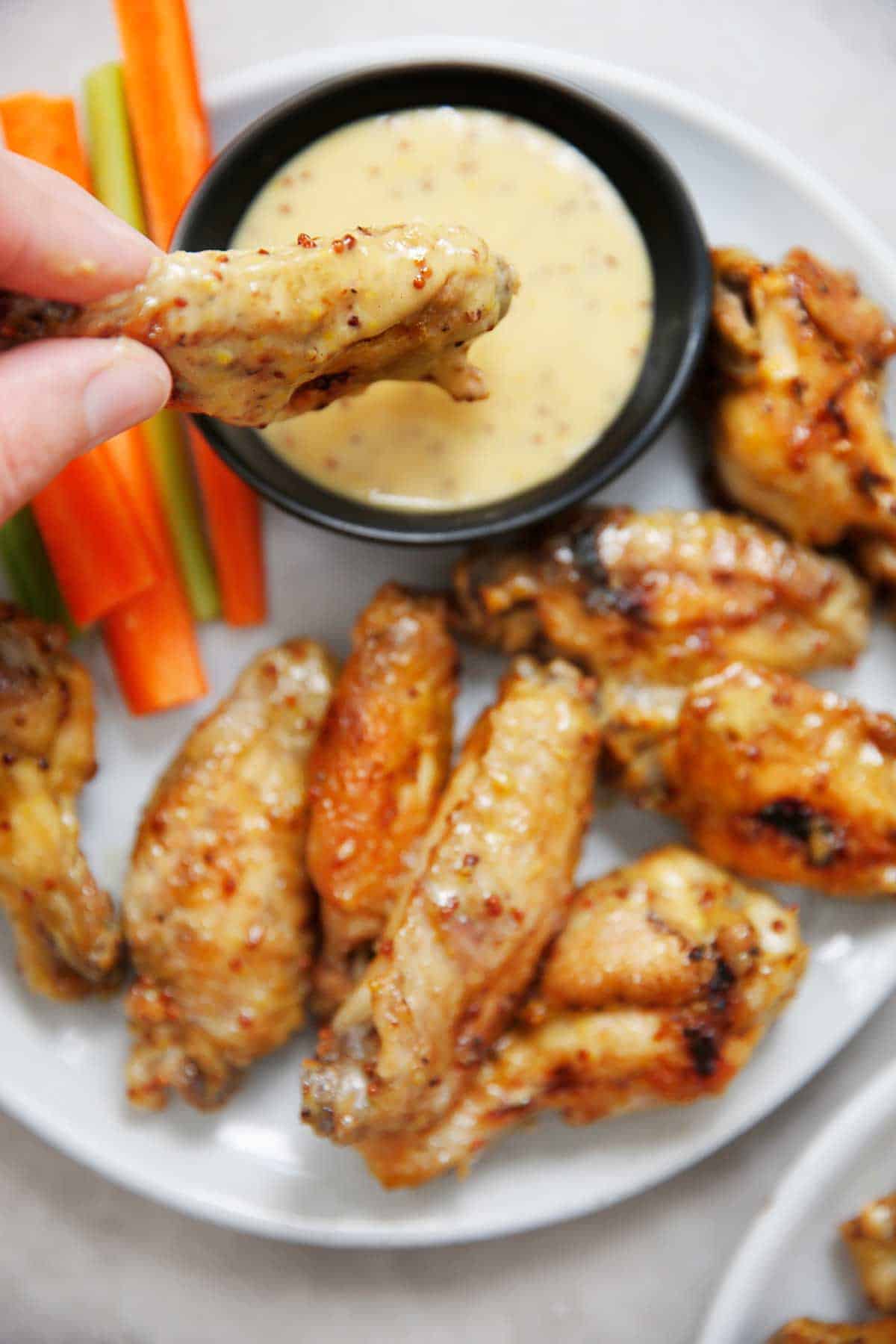 Chicken Wings in Instant Pot Dipping into Honey Mustard 