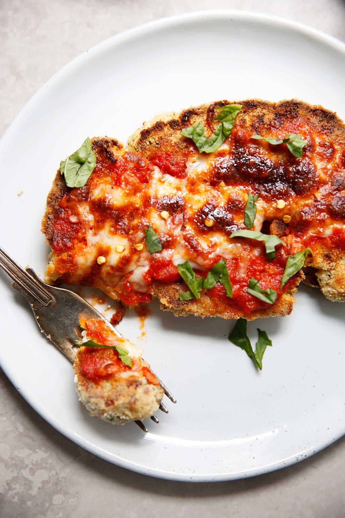 cauliflower parmesan with a bite taken out from above.