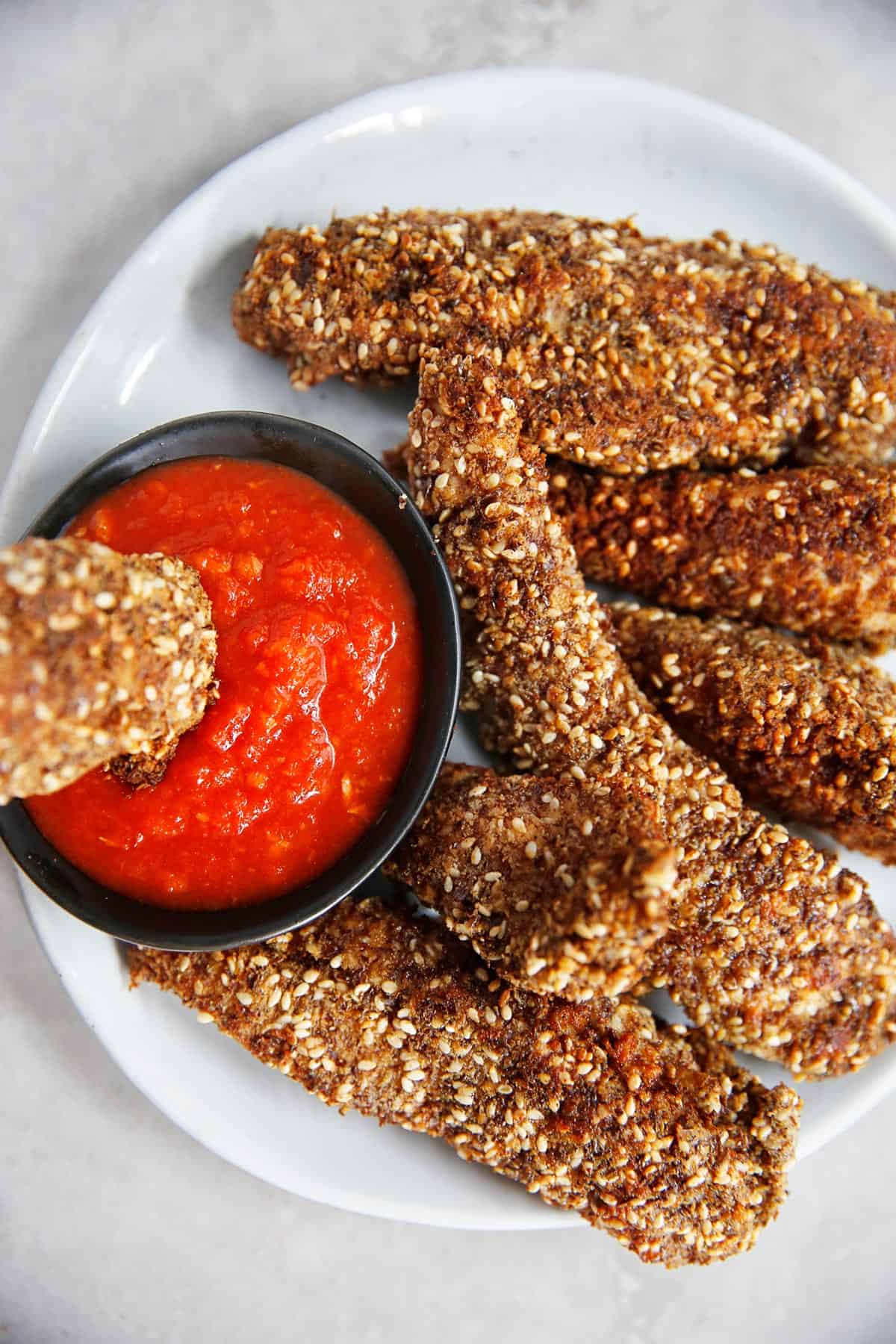 Crispy Sesame Chicken Tenders with dipping sauce
