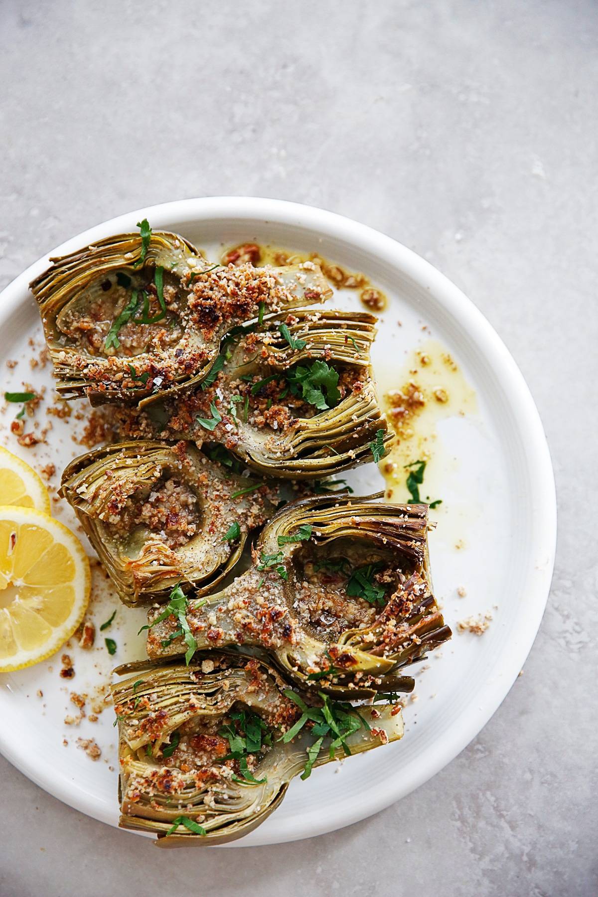 Braised Artichokes with pecan breadcrumbs on a plate