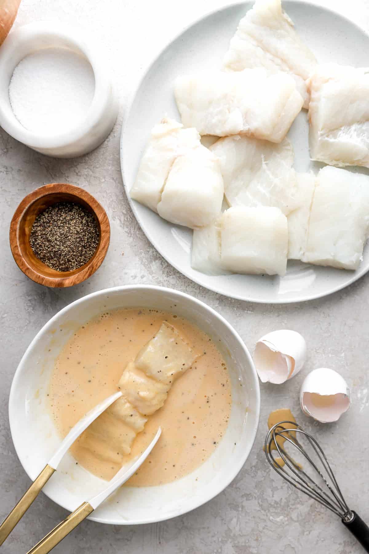 Cod filets being battered.