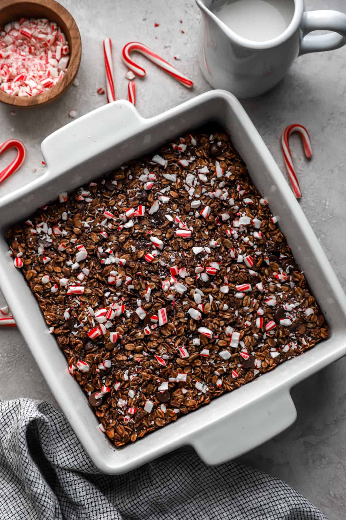 a baking dish with a chocolate oatmeal bake topped with peppermint candy.