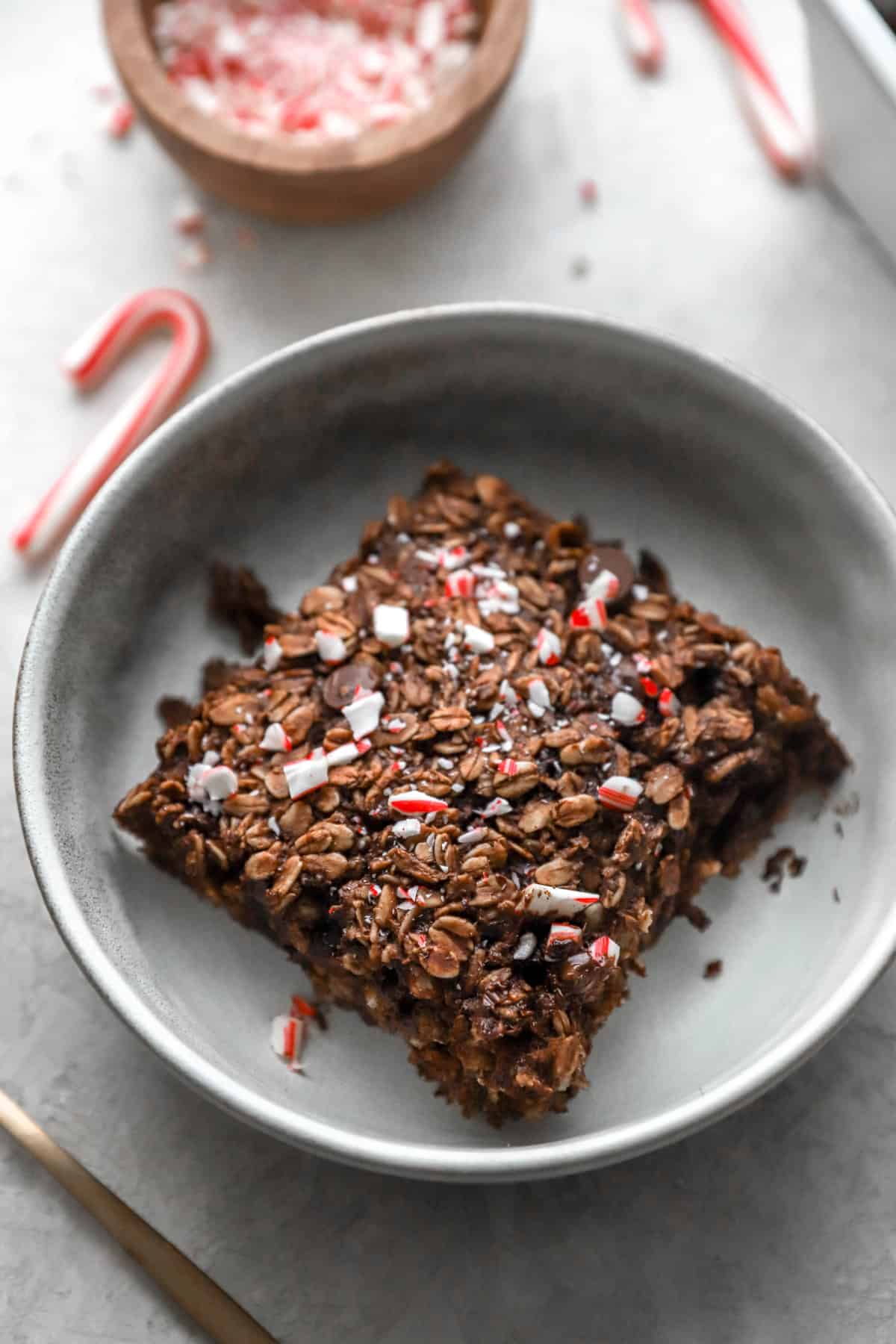 above image of a slice of chocolate peppermint baked oatmeal in a bowl.