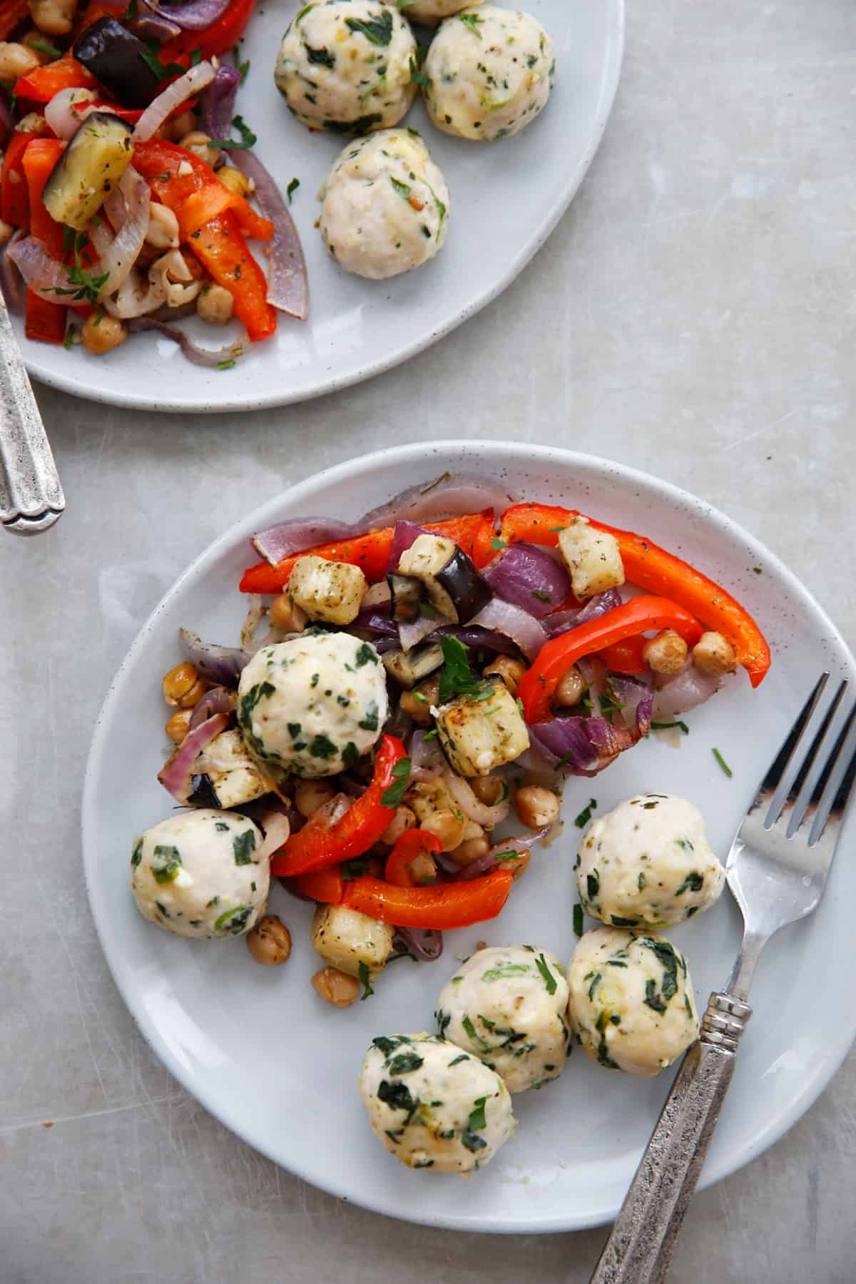 Greek meatball dinner on plates