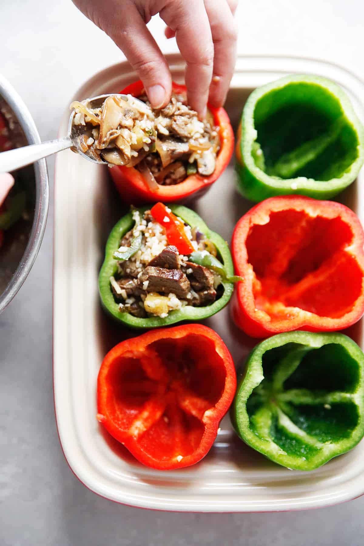 Making Philly cheesesteak stuffed peppers recipe