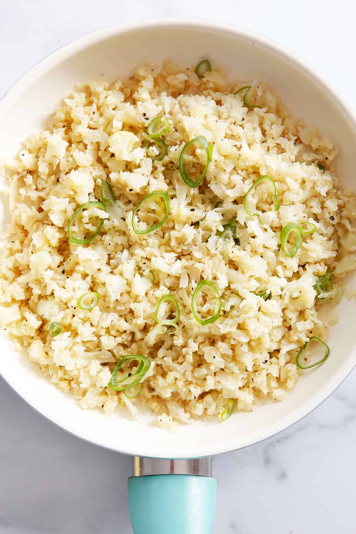 A skillet with homemade cauliflower rice.