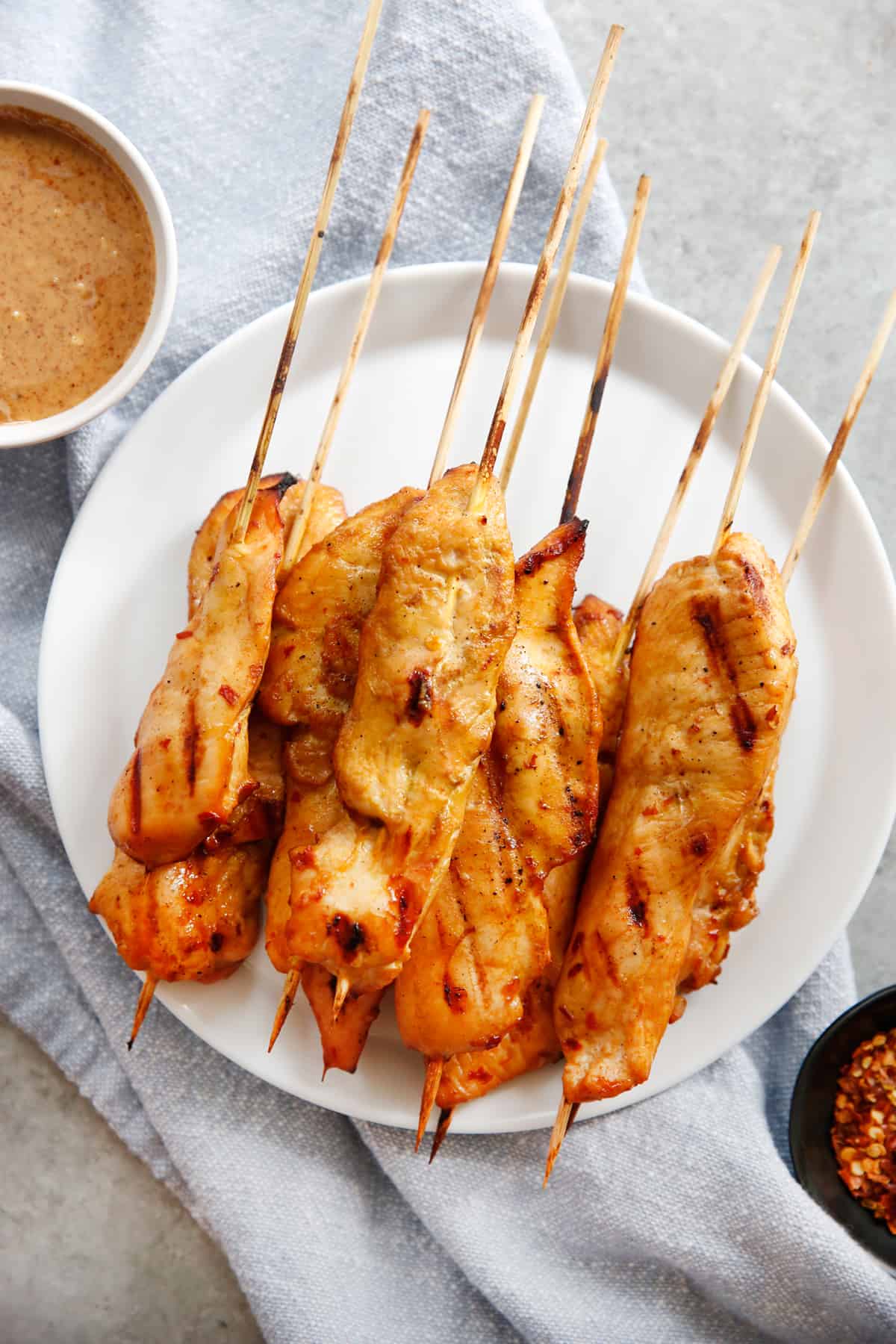 chicken satay skewers on a plate