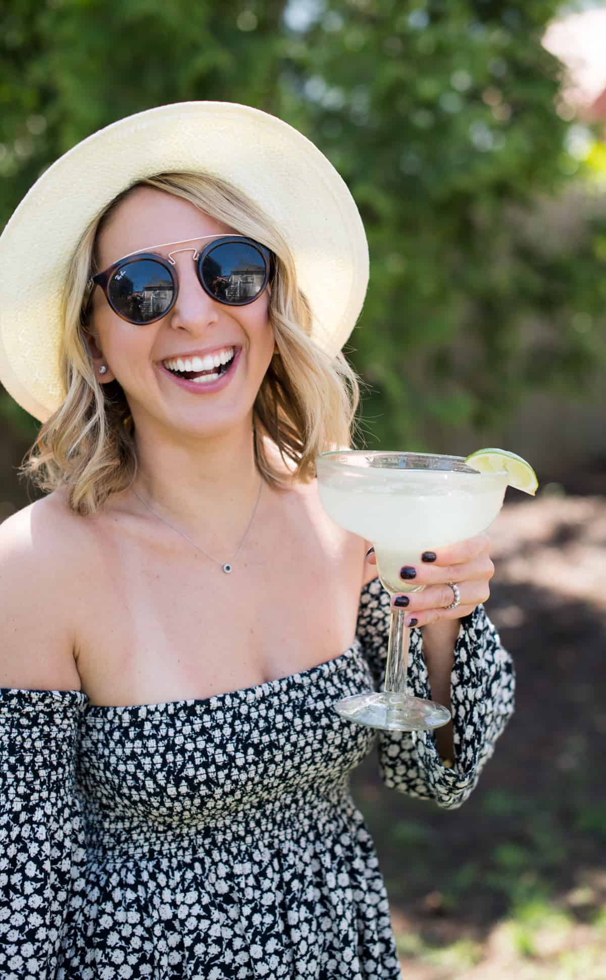 Lexi holding a margarita