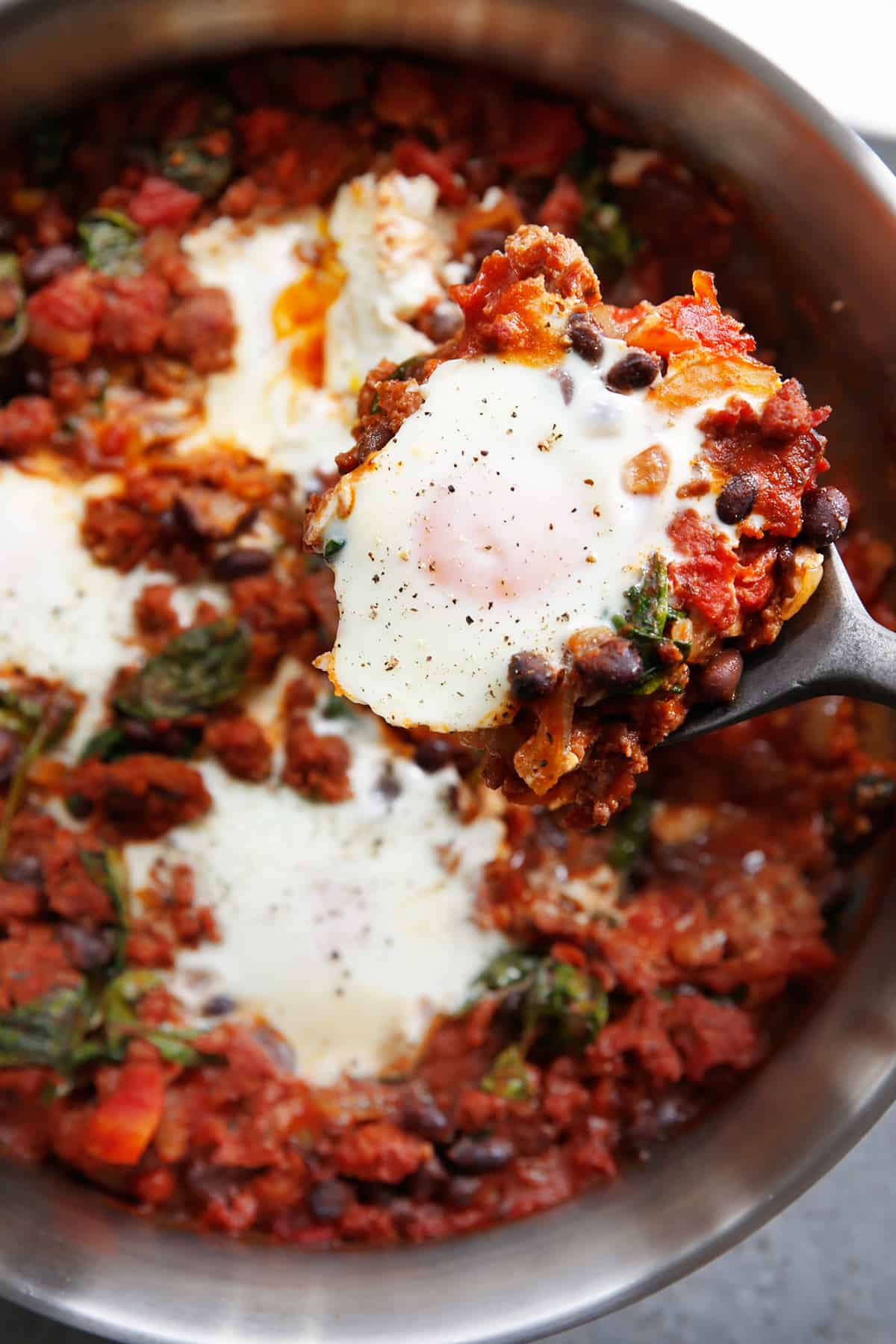 Skillet baked eggs with chorizo before serving.