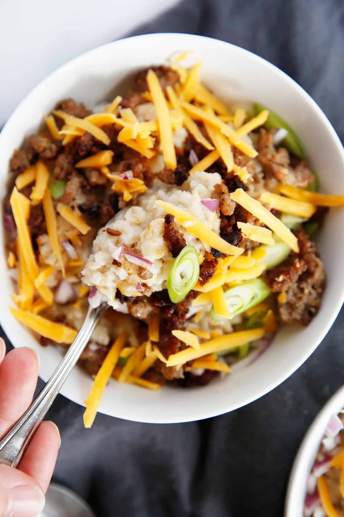 Bowl full with savory oatmeal breakfast