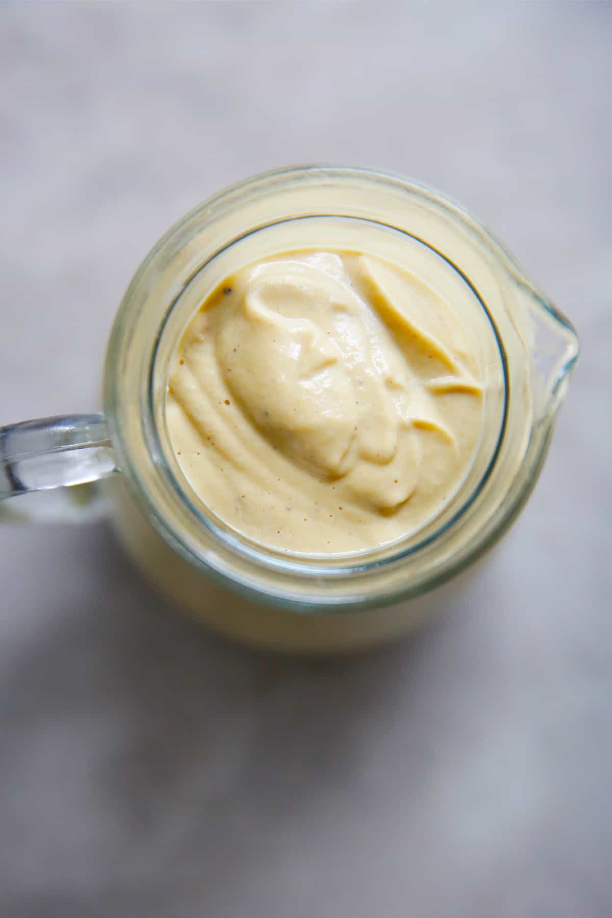 a pitched of vegan cheese sauce made with cashews