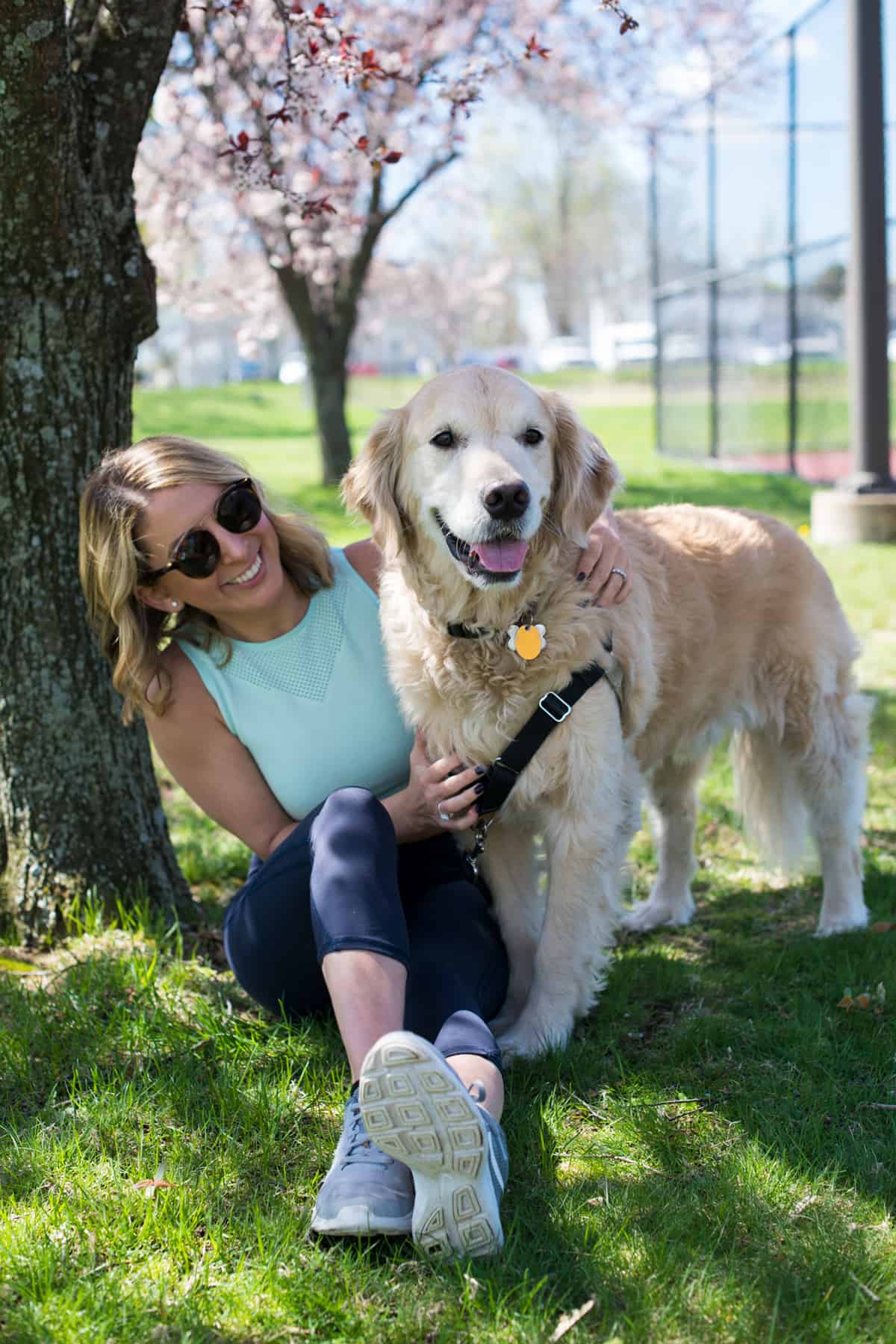 Woman in an exercise outfit with a dog.