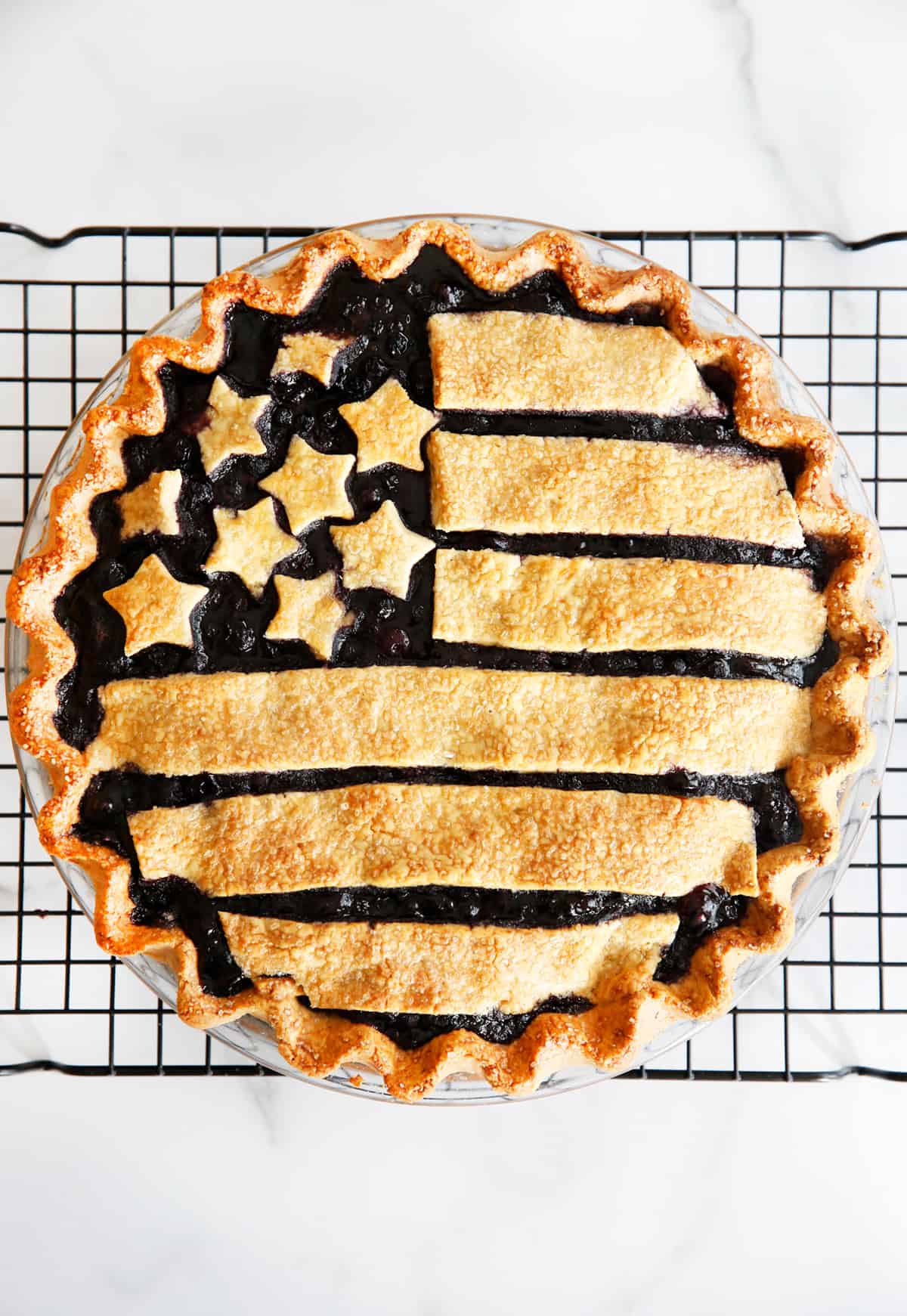 gluten free blueberry pie on a cooling rack