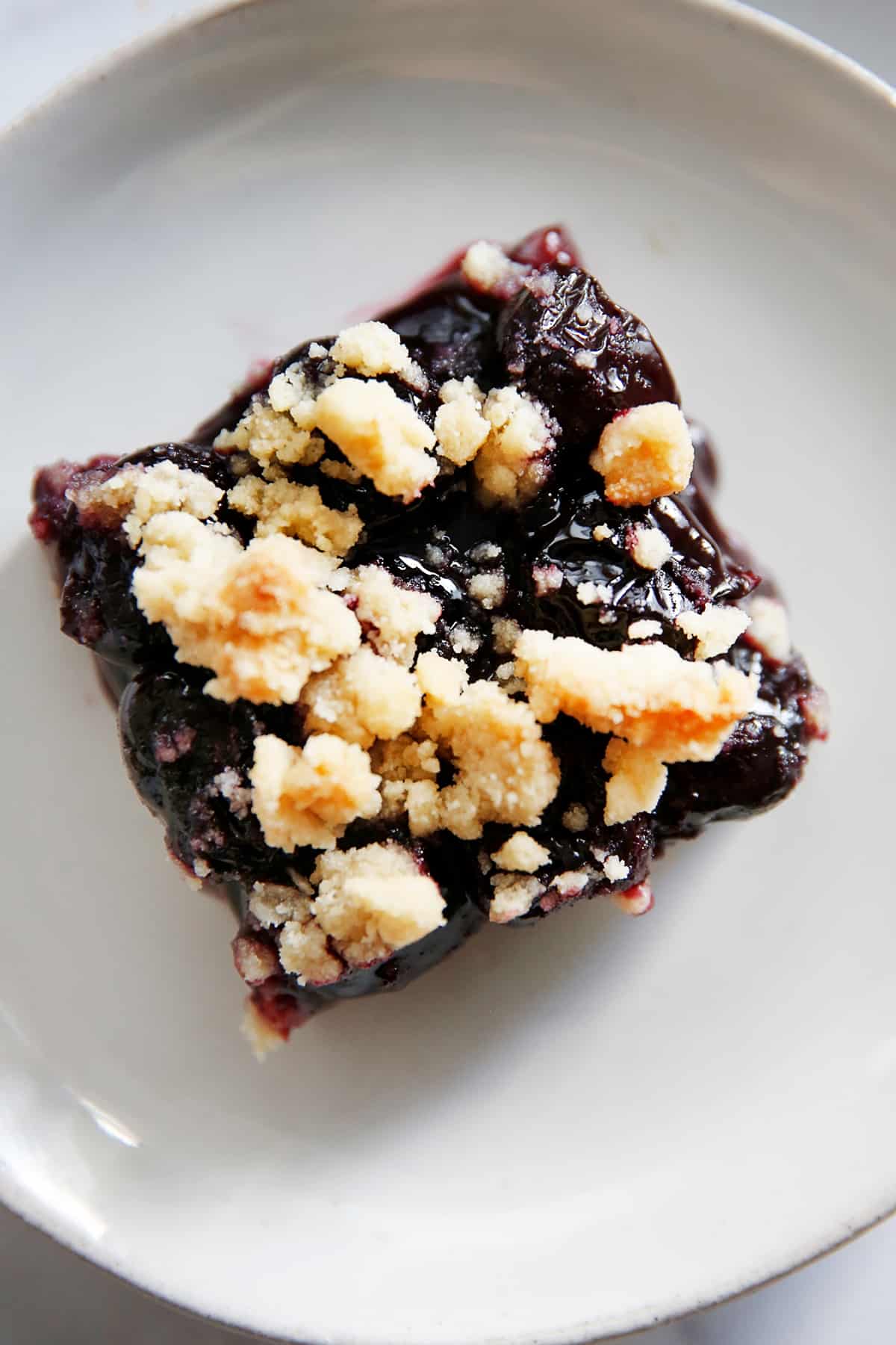 Cherry pie bars on a plate.