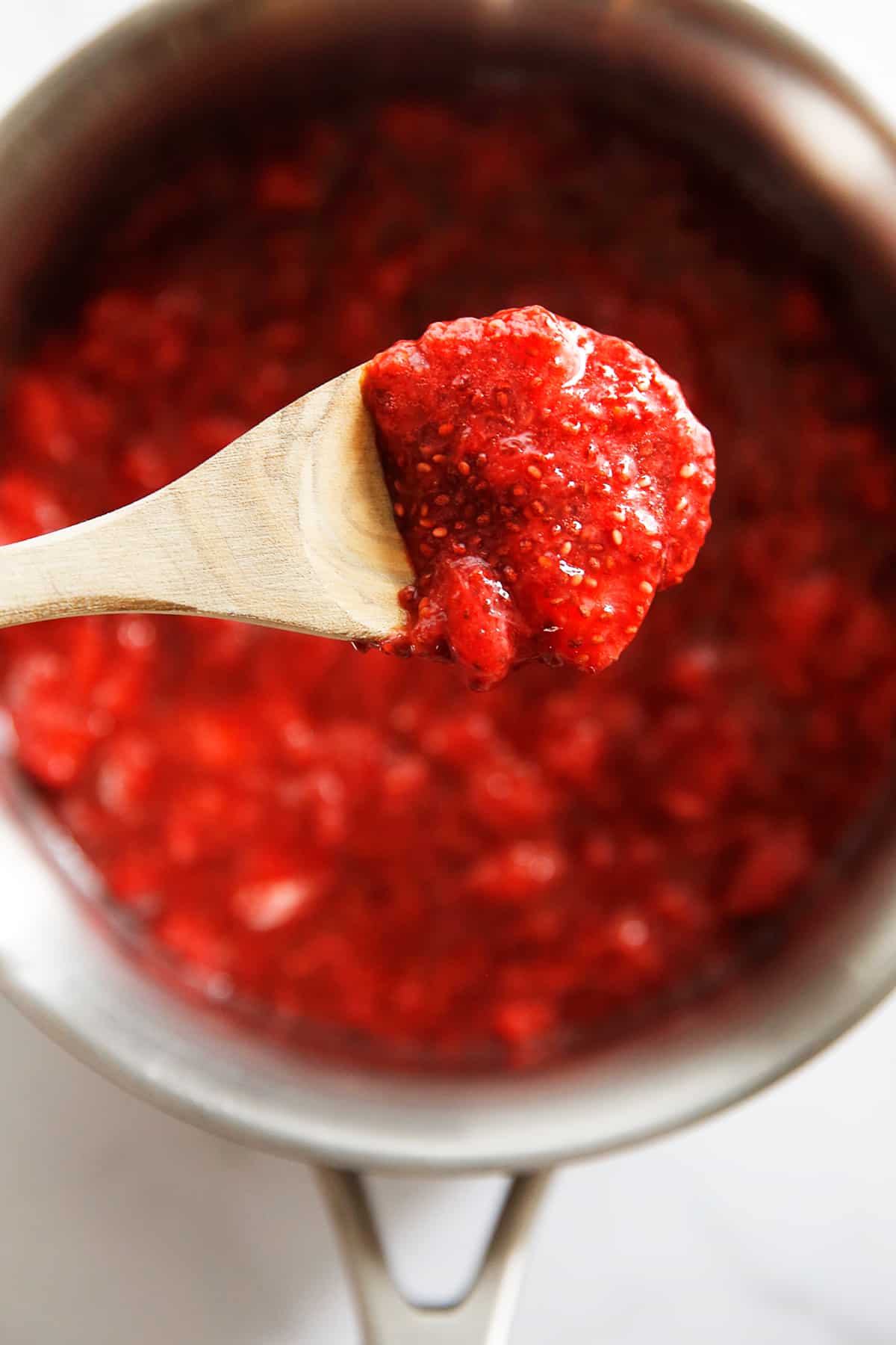 chia seed jam in a pot made from strawberries