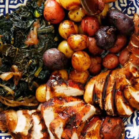 Instant Pot Balsamic Chicken on a platter with kale and potatoes.