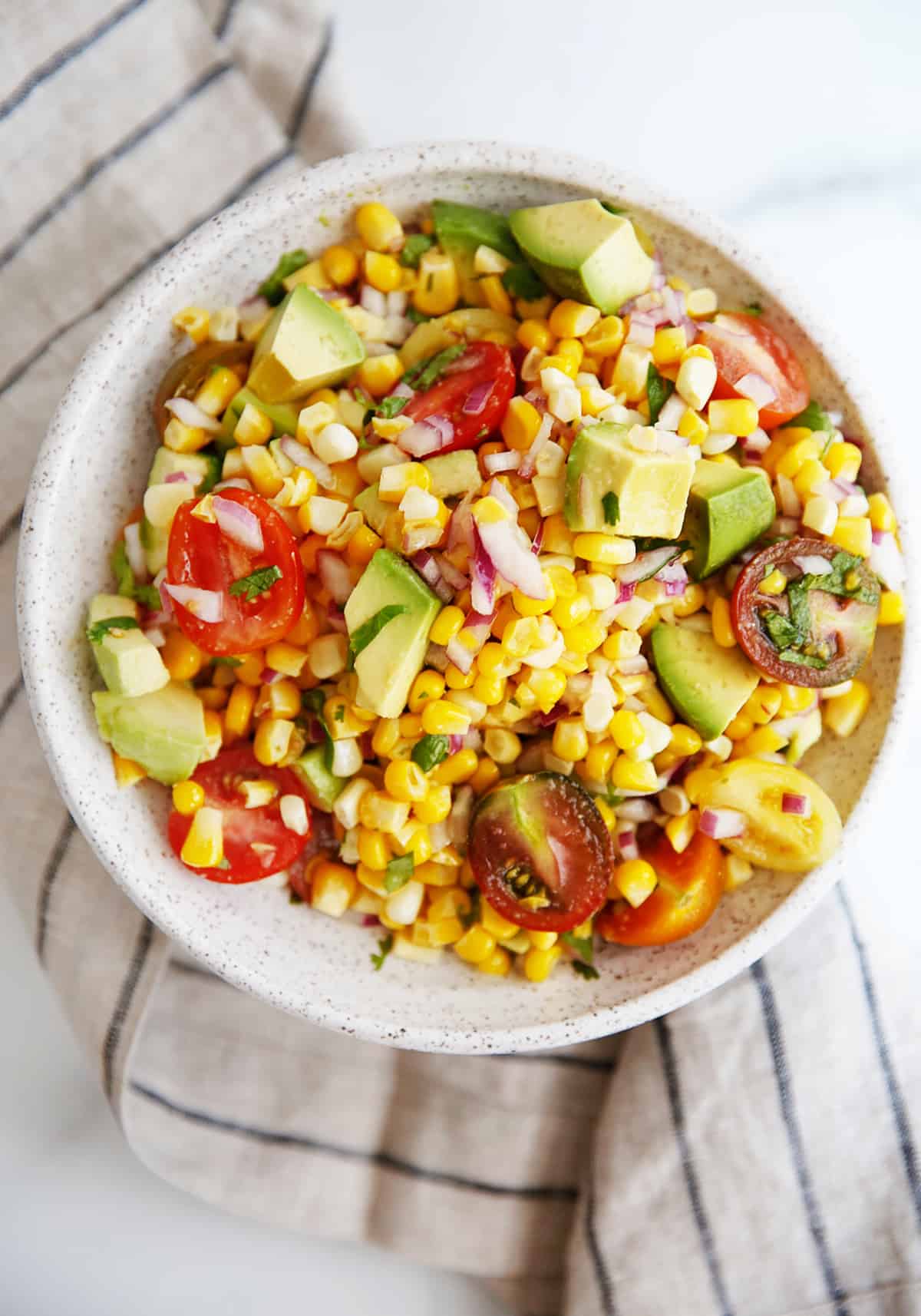 Corn and avocado salsa recipe in a bowl