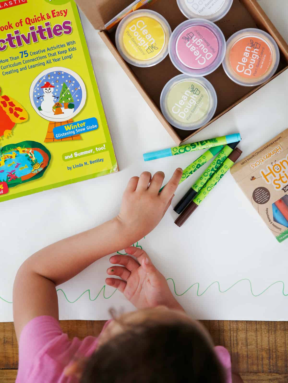 Girl coloring with non toxic art supplies