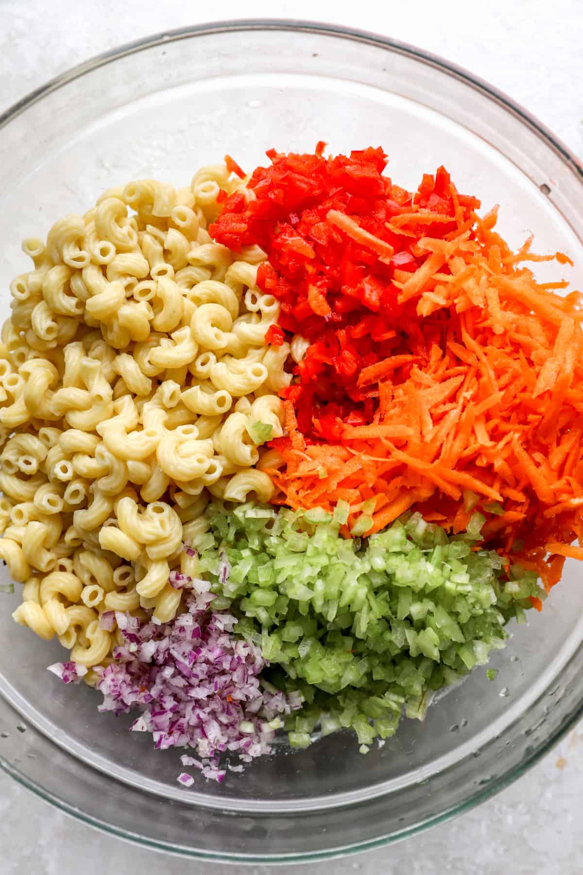 ingredients for pasta salad in a bowl from above.