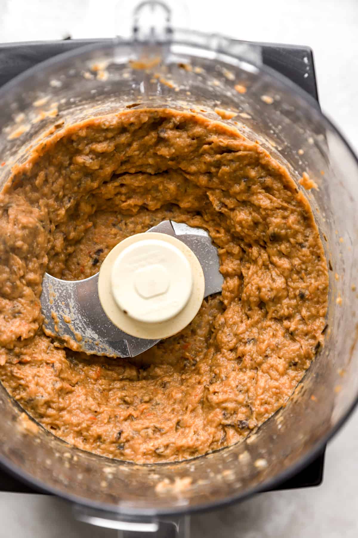 Submerge the eggplant mixture in a food processor.