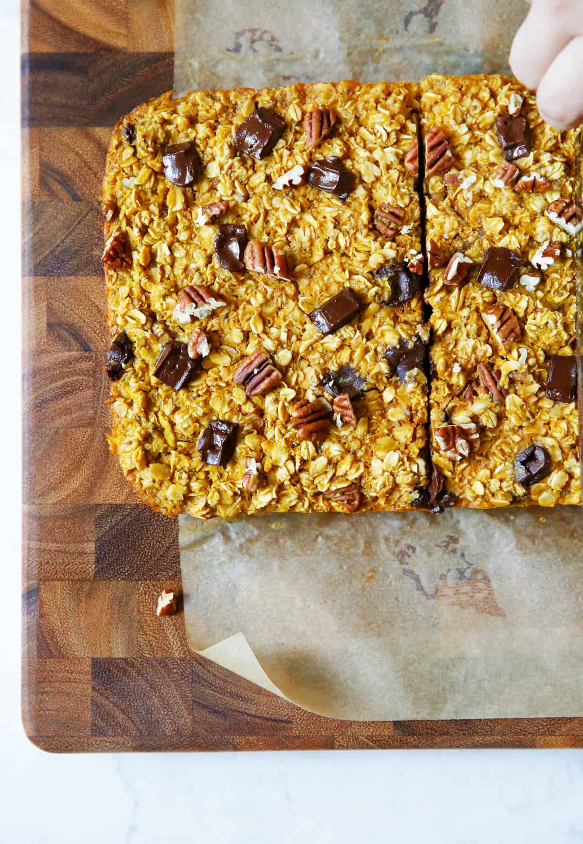 cutting squares of pumpkin baked oatmeal