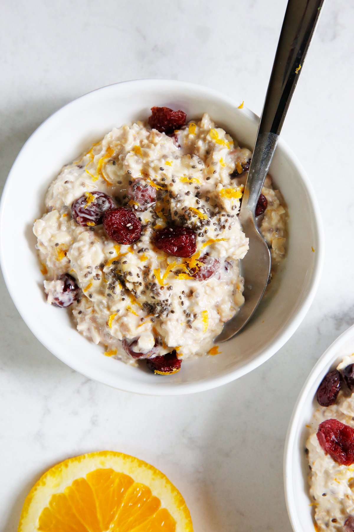 Bowl of overnight oats with cranberries and orange