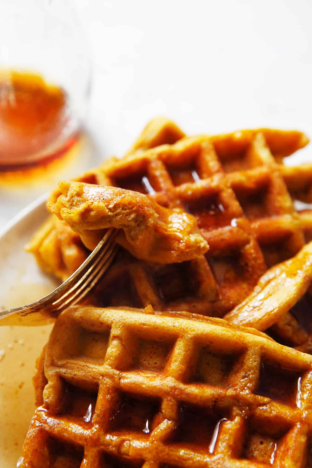 gluten free pumpkin waffles on a fork.