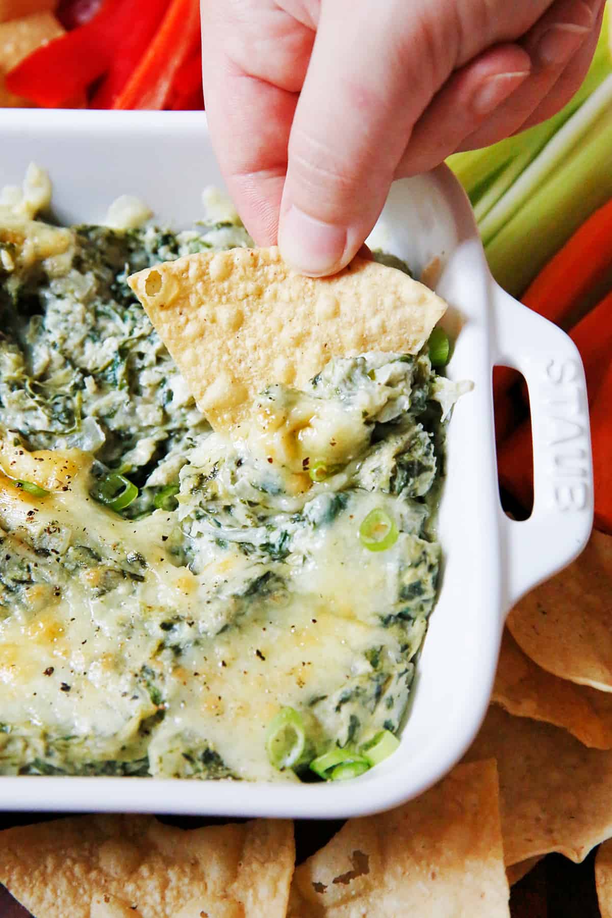 Healthy spinach artichoke dip on a serving plate.