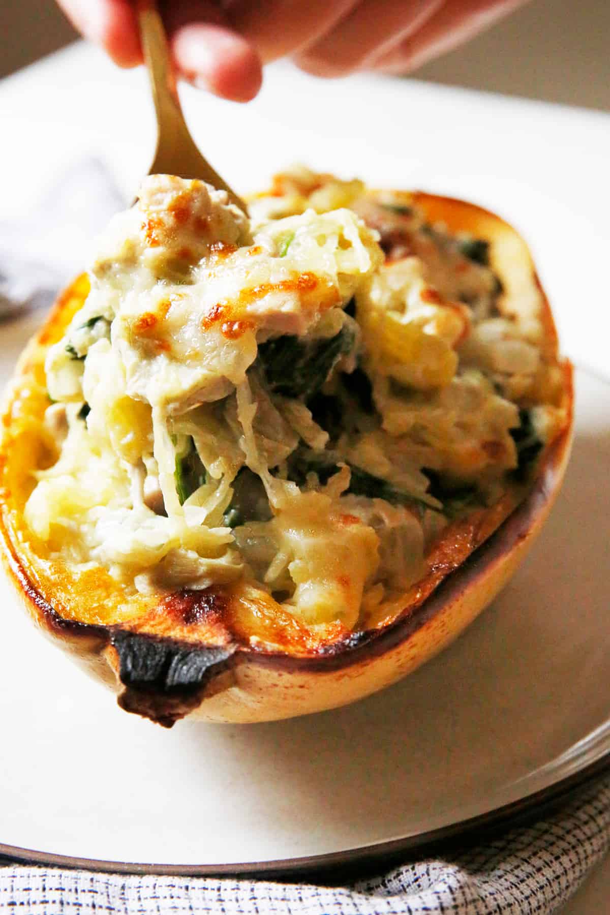 stuffed spaghetti squash with spinach and artichoke filling