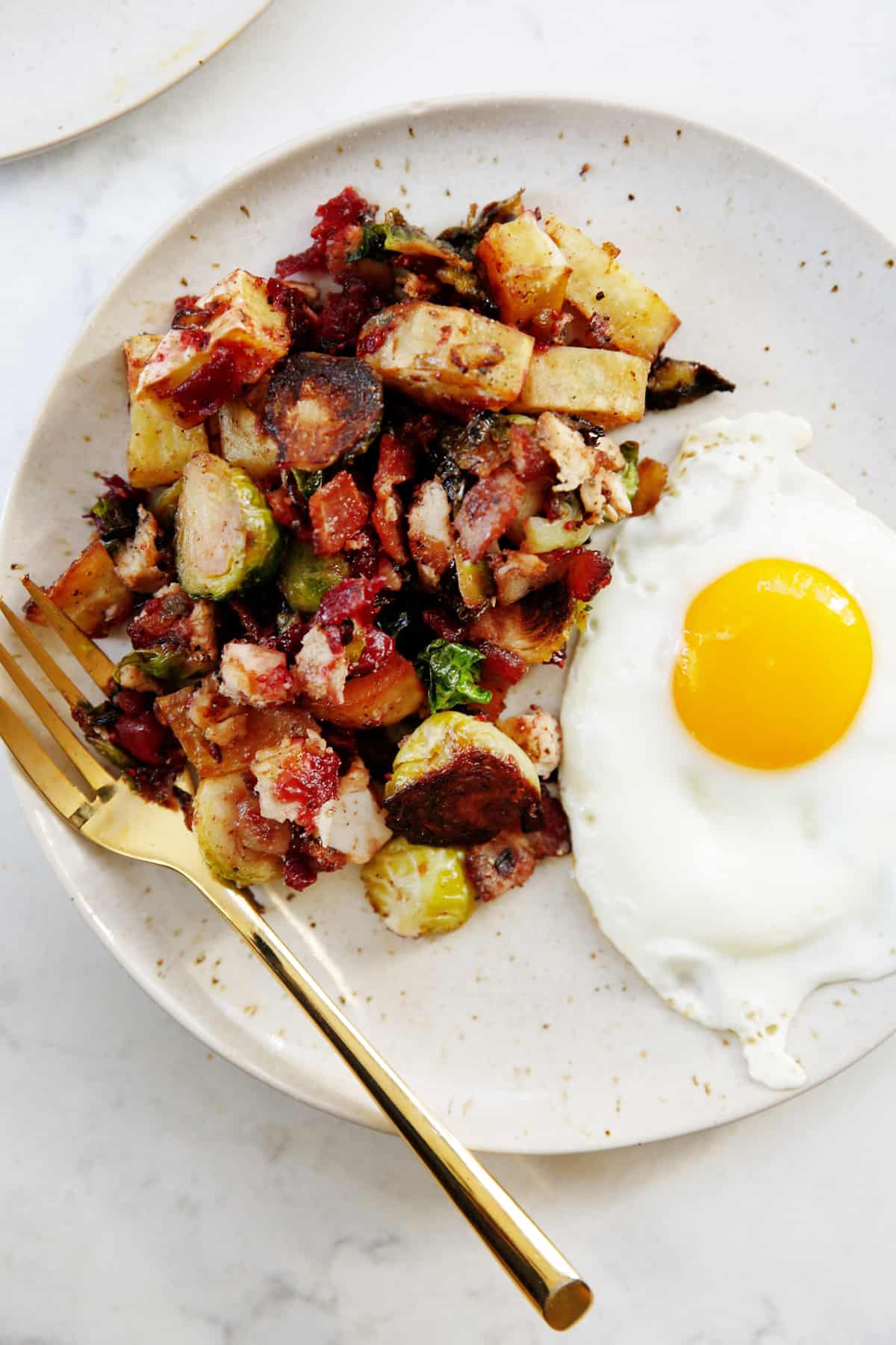Thanksgiving leftover breakfast hash with a fried egg