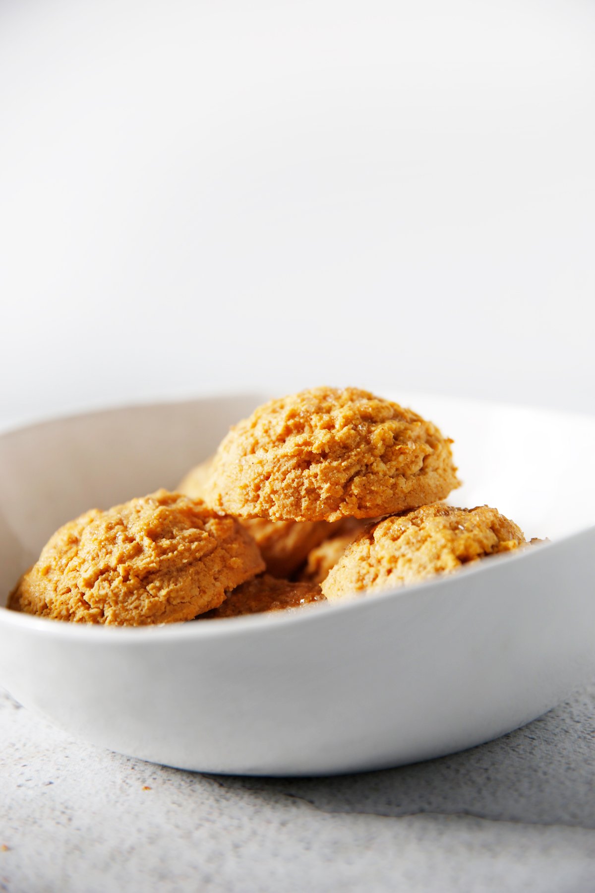 Gluten free pumpkin biscuits in a bowl.