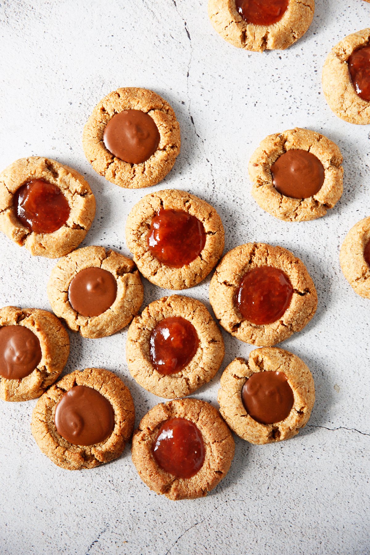 Gluten free thumbprint cookies filled with Nutella and jam.